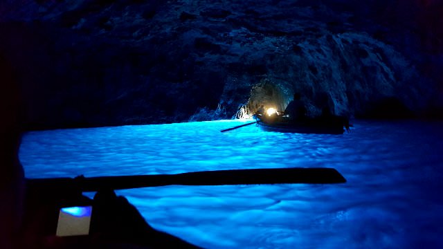 Gorgeous blue water from an amazing light- reflection inside the world-famous Blue Grotto on the Island of Capri, Italy 
